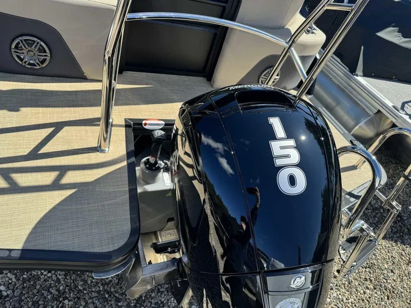 Slide: The Image of 2024 Harris Cruiser 230 with 150 HP engine, rear deck view. - 6