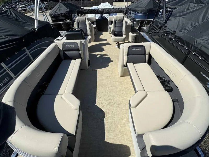 Slide: The Image of 2024 Harris Cruiser 230 pontoon boat interior with spacious seating and modern design. - 9