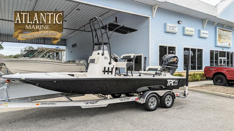 Slide: The Image of 2024 Tidewater 23 TPC Raptor boat on trailer at Atlantic Marine dealership. - 1