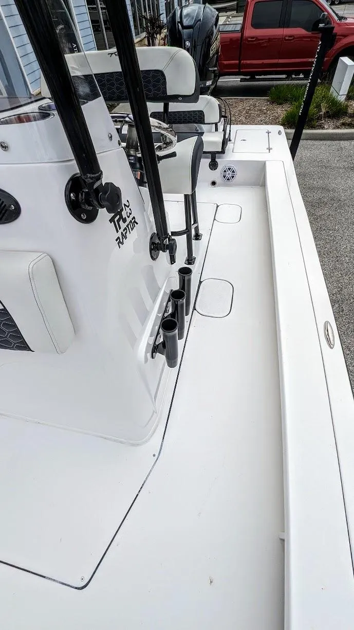 Slide: The Image of 2024 Tidewater 23 TPC Raptor boat deck with fishing rod holders. - 11