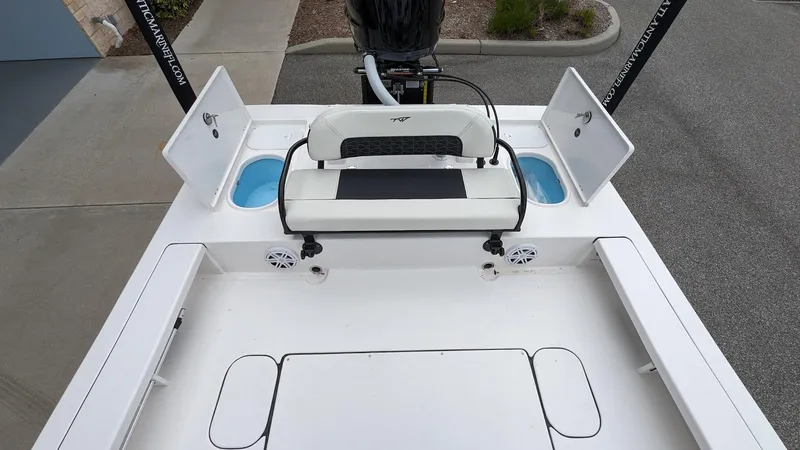 Slide: The Image of 2024 Tidewater 23 TPC Raptor boat interior with seating and storage compartments. - 15