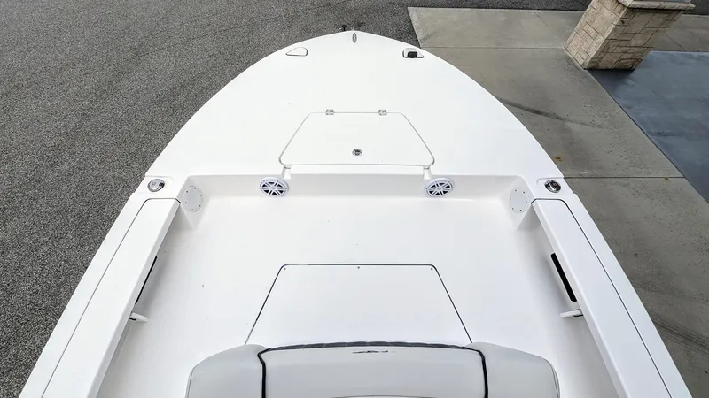 Slide: The Image of 2024 Tidewater 23 TPC Raptor boat, top view of sleek white deck design. - 16