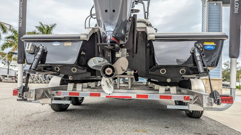 Slide: The Image of 2024 Tidewater 23 TPC Raptor boat on trailer, rear view with propeller and trim tabs. - 5