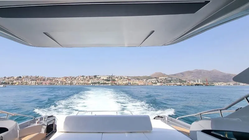 Slide: The Image of View from the Rizzardi In Five 2024 yacht, cruising on a clear blue sea. - 3