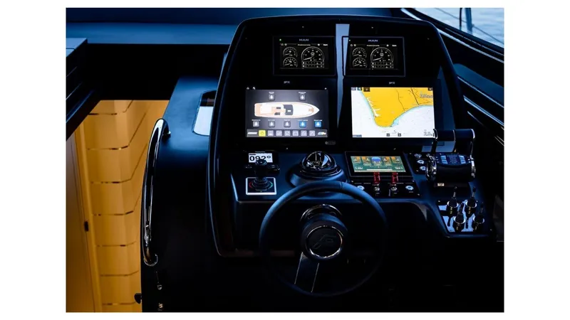 Slide: The Image of Control panel of 2024 Rizzardi In Five yacht with navigation screens and controls. - 6