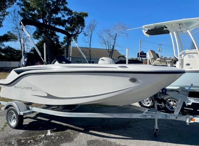Slide: The Image of 2024 Bayliner Element M15 boat on a trailer, side view. - 0