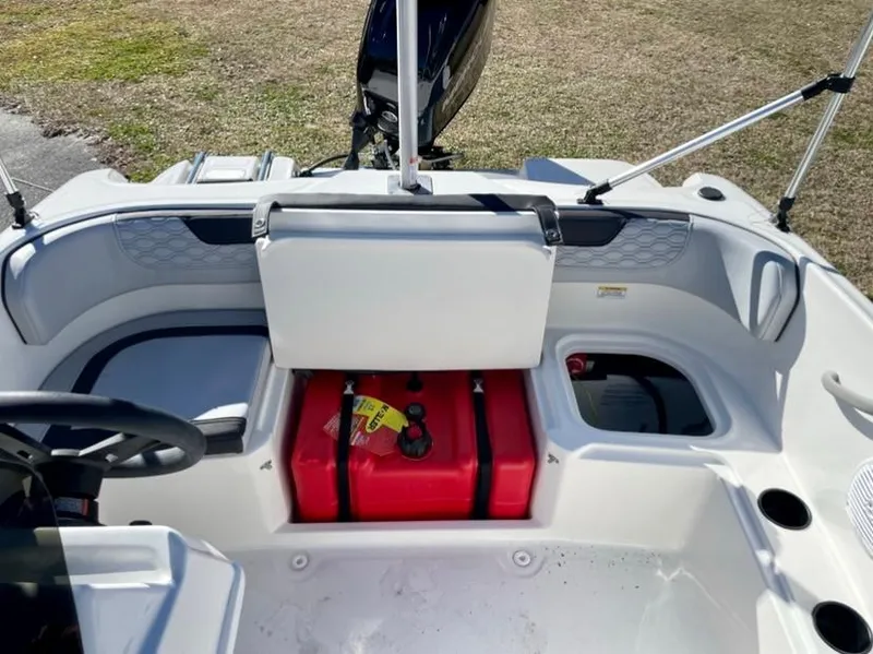 Slide: The Image of 2024 Bayliner Element M15 boat interior with red fuel tank and seating. - 7