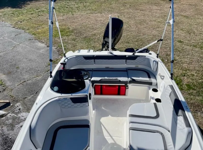 Slide: The Image of 2024 Bayliner Element M15 boat interior with seating and storage compartments. - 6