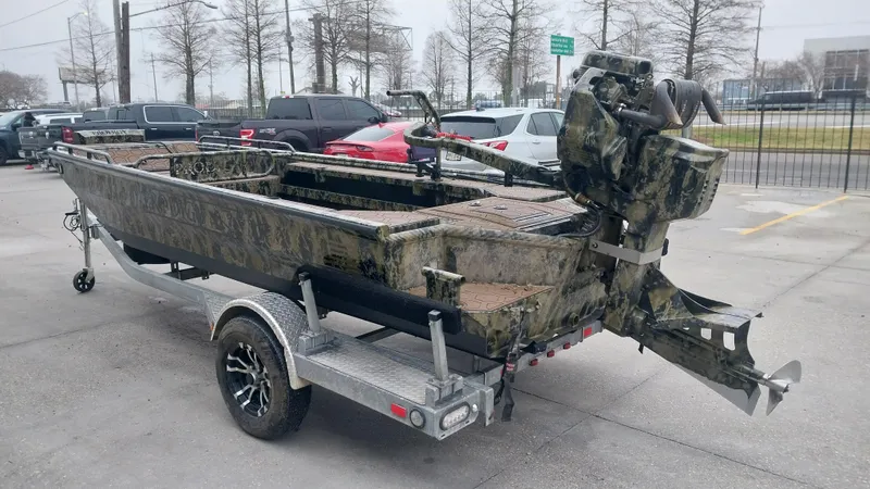 Slide: The Image of 2022 Prodigy 18x60 Marsh Tuff boat on a trailer in a parking lot. - 11