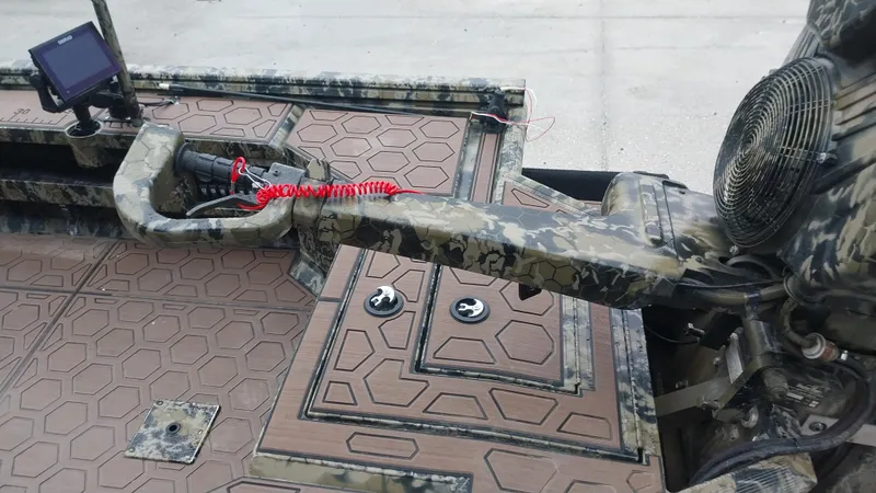 Slide: The Image of 2022 Prodigy 18x60 Marsh Tuff boat with camo pattern and advanced navigation system. - 3