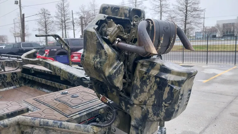 Slide: The Image of 2022 Prodigy 18x60 Marsh Tuff boat with camo design and powerful engine. - 4