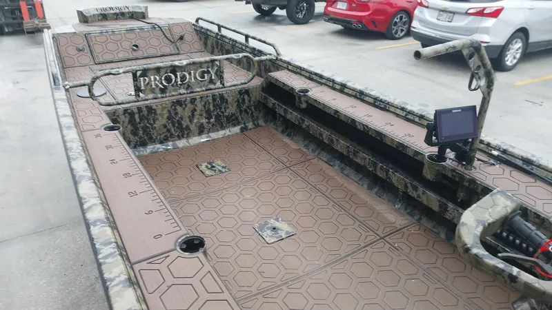 Slide: The Image of 2022 Prodigy 18x60 Marsh Tuff boat with camo design and advanced navigation system. - 5