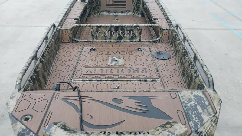 Slide: The Image of 2022 Prodigy 18x60 Marsh Tuff boat interior with camouflage design. - 6
