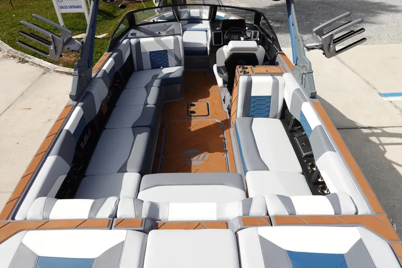 Slide: The Image of 2023 Malibu 25 LSV boat interior with spacious seating and modern design. - 12