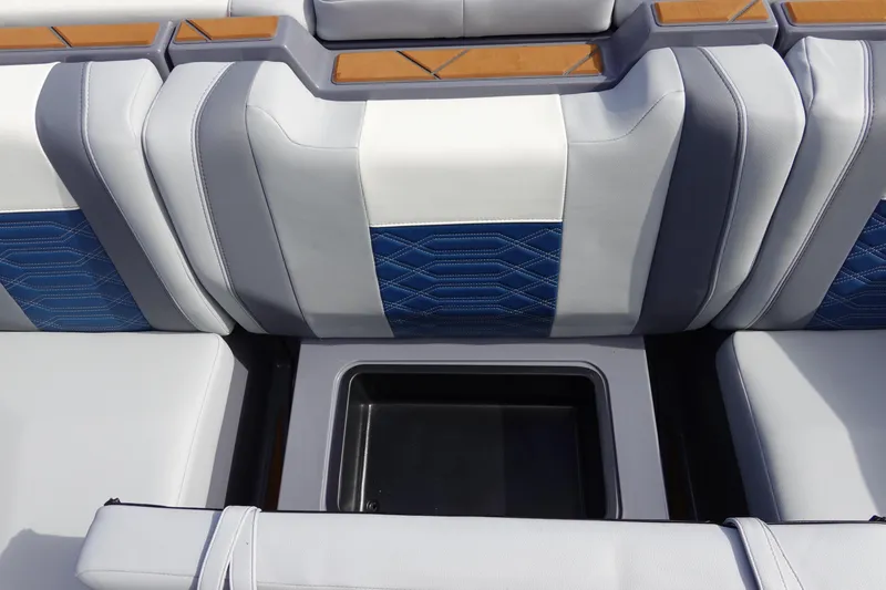 Slide: The Image of 2023 Malibu 25 LSV boat interior seating with storage compartment. - 29