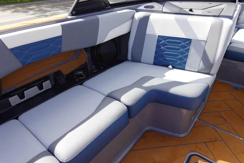 Slide: The Image of 2023 Malibu 25 LSV boat interior with luxurious seating and modern design. - 33