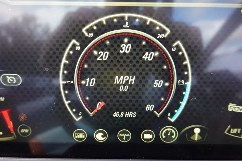 Slide: The Image of 2023 Malibu 25 LSV speedometer displaying 0 MPH and 46.8 hours of use. - 39