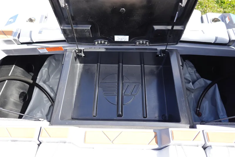 Slide: The Image of 2023 Malibu 25 LSV storage compartment with open lid. - 46