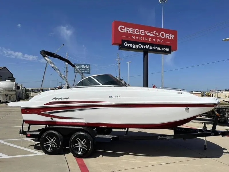 Slide: The Image of 2023 Hurricane SD187-IO boat on trailer at Gregg Orr Marine & RV dealership. - 1