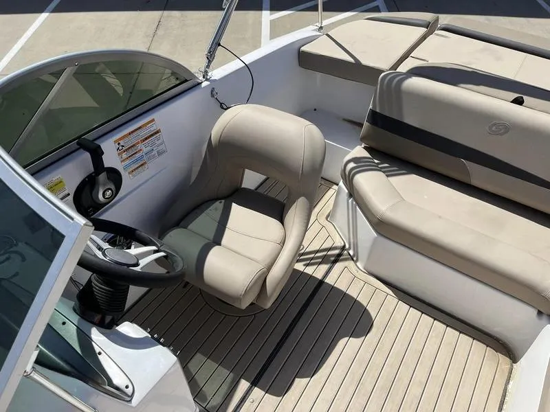 Slide: The Image of 2023 Hurricane SD187-IO boat interior with beige seating and steering wheel. - 13