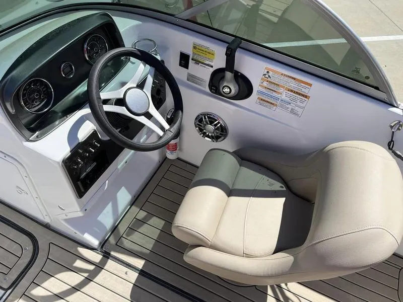 Slide: The Image of 2023 Hurricane SD187-IO boat cockpit with steering wheel and captain's chair. - 16