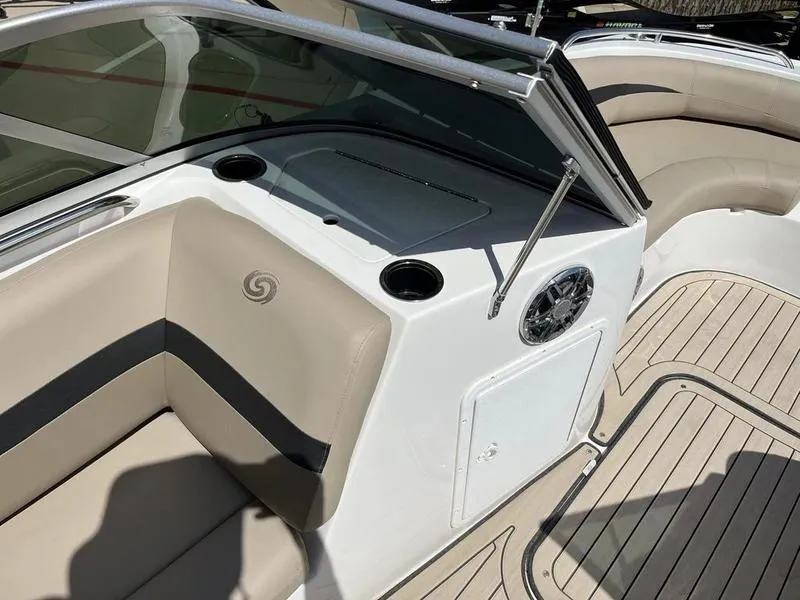Slide: The Image of 2023 Hurricane SD187-IO boat interior with beige seating and cup holders. - 18