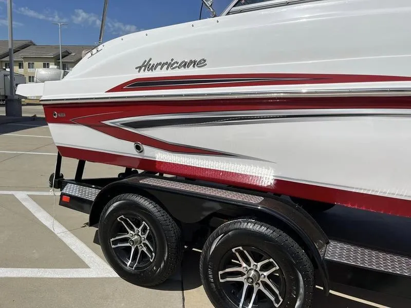 Slide: The Image of 2023 Hurricane SD187-IO boat on a trailer in a parking lot. - 5