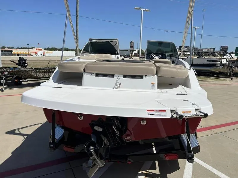 Slide: The Image of 2023 Hurricane SD187-IO boat on display at a marina. - 7