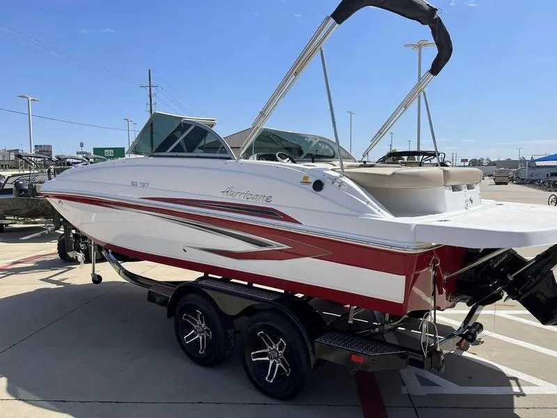 Slide: The Image of 2023 Hurricane SD187-IO boat on trailer in parking lot. - 9