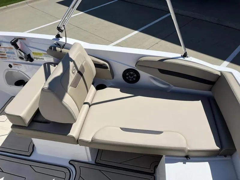 Slide: The Image of 2023 Hurricane SS205-OB boat with beige seating and cup holders. - 13