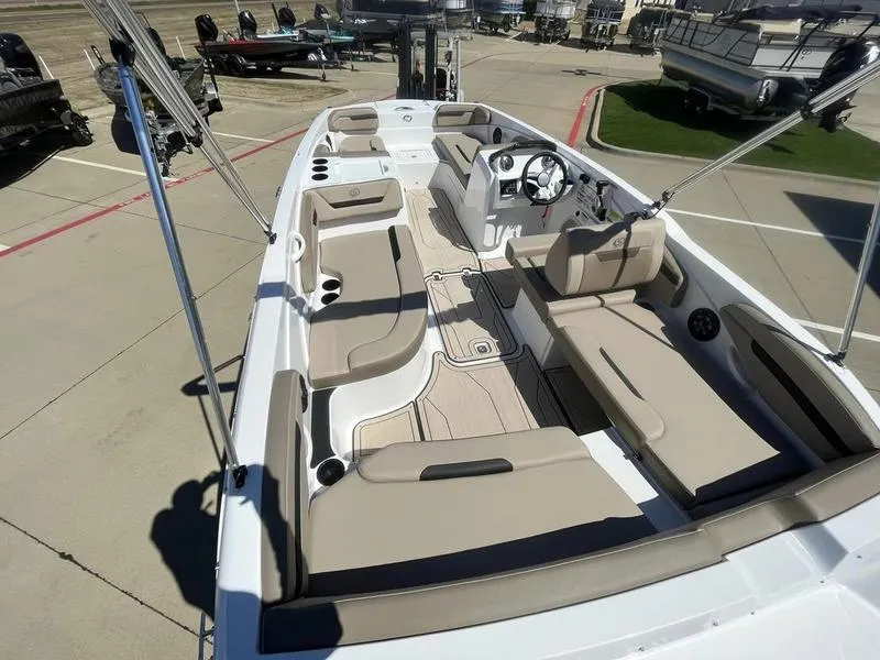 Slide: The Image of 2023 Hurricane SS205-OB boat with spacious seating and modern dashboard. - 16