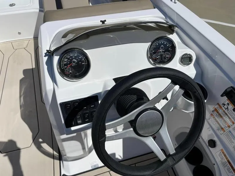 Slide: The Image of 2023 Hurricane SS205-OB boat dashboard with steering wheel and gauges. - 18