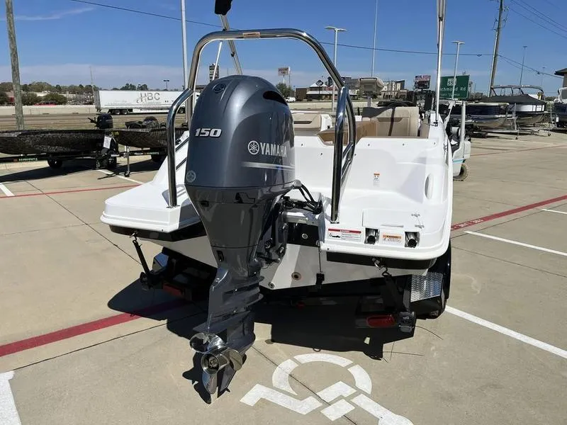 Slide: The Image of 2023 Hurricane SS205-OB boat with Yamaha 150 outboard motor in parking lot. - 5