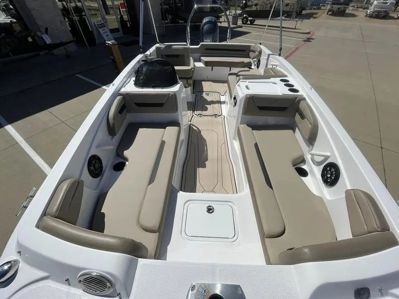 Slide: The Image of 2023 Hurricane SS205-OB boat interior with beige seating and spacious layout. - 8