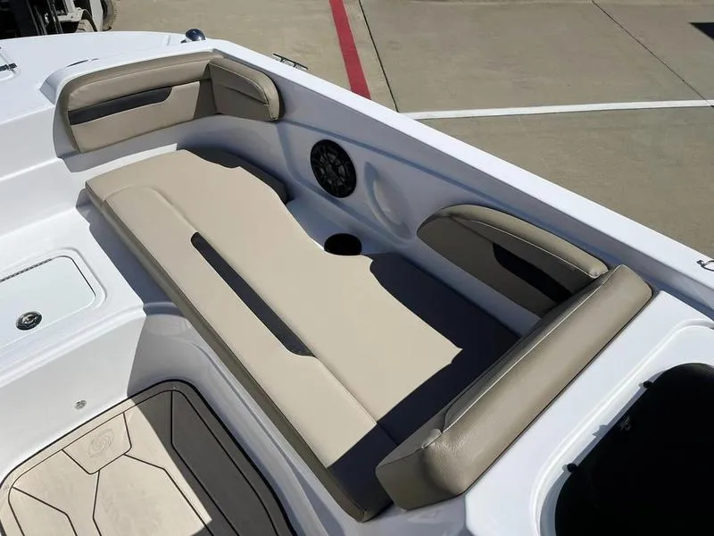 Slide: The Image of 2023 Hurricane SS205-OB boat with beige seating and speaker system. - 9