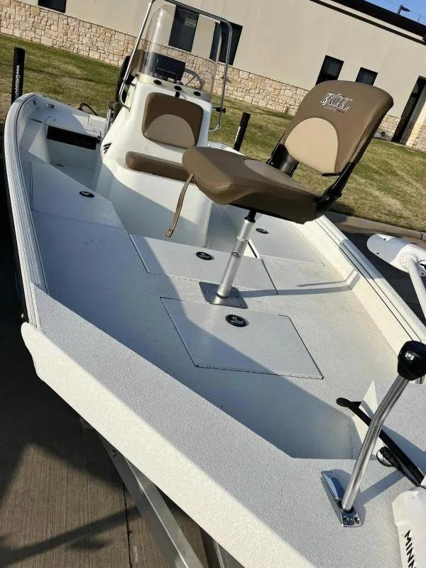 Slide: The Image of 2023 Excel Boats 203 Bay Pro, white fishing boat with seating and storage compartments. - 15
