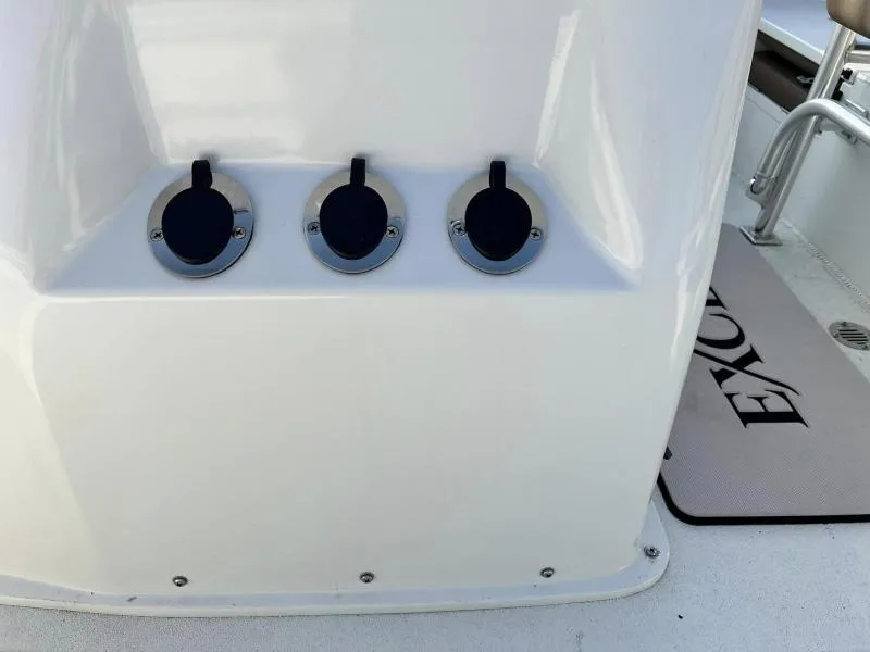 Slide: The Image of 2023 Excel Boats 203 Bay Pro console with three covered outlets. - 9