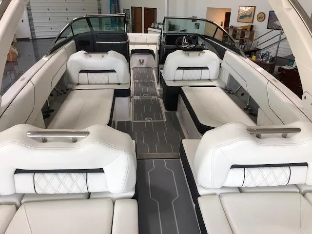 Slide: The Image of 2021 Regal LS6 boat interior with white leather seating and modern design. - 21