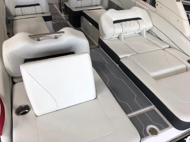 Slide: The Image of 2021 Regal LS6 boat interior with white leather seating and modern design. - 22