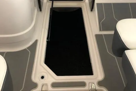 Slide: The Image of 2021 Regal LS6 boat interior storage compartment with open hatch. - 26