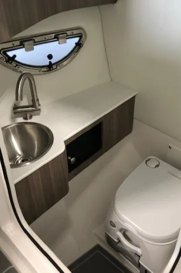 Slide: The Image of 2021 Regal LS6 boat bathroom with sink and toilet - 27