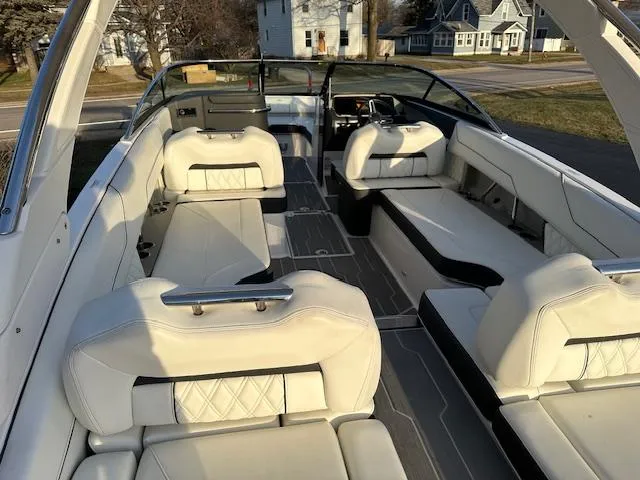 Slide: The Image of 2021 Regal LS6 boat interior with white leather seating and modern design. - 4