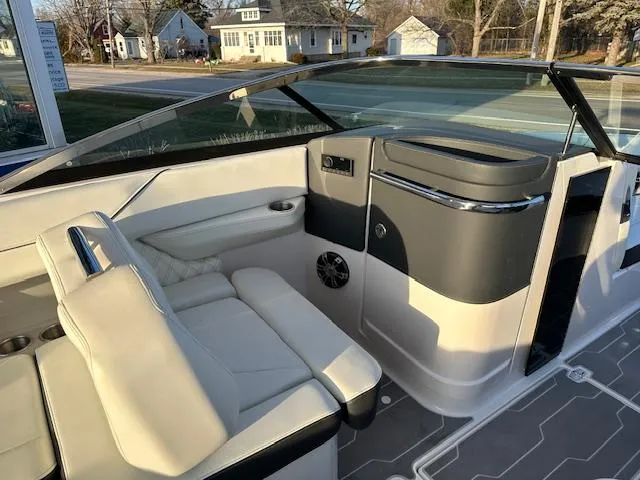 Slide: The Image of 2021 Regal LS6 boat interior with white leather seats and modern dashboard. - 9