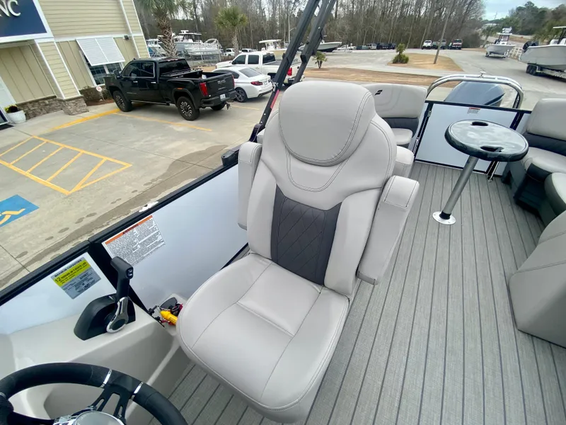 Slide: The Image of 2023 Starcraft SLS 3 boat interior with captain's chair and seating area. - 14