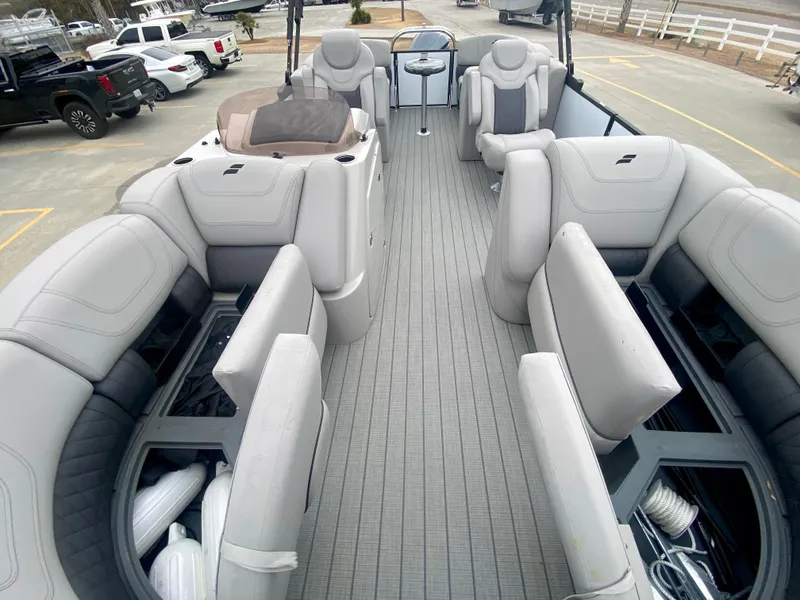Slide: The Image of 2023 Starcraft SLS 3 pontoon boat interior with spacious seating and storage compartments. - 20