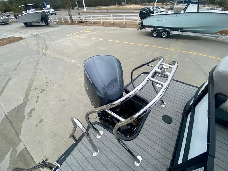 Slide: The Image of 2023 Starcraft SLS 3 boat with outboard motor at a marina. - 5