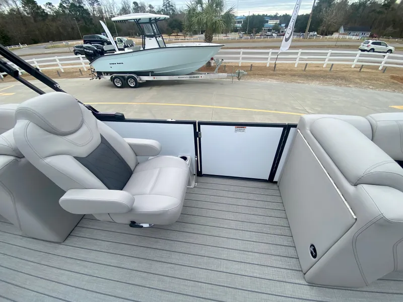 Slide: The Image of 2023 Starcraft SLS 3 boat interior with plush seating and modern design. - 9