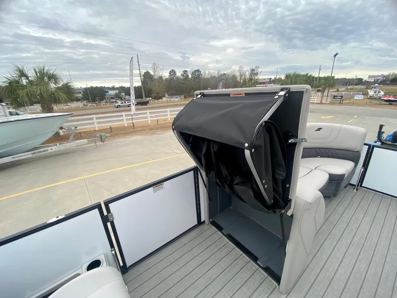 Slide: The Image of 2023 Starcraft SLS 3 pontoon boat with seating and storage compartment. - 12
