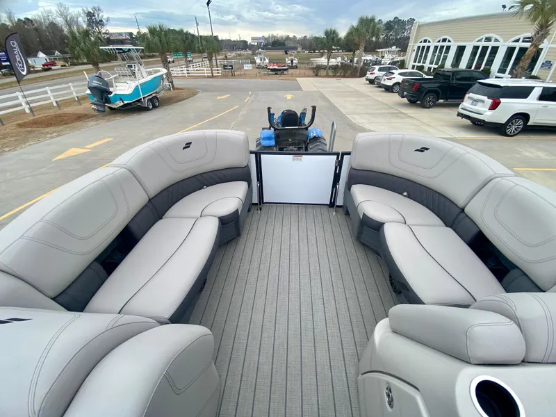 Slide: The Image of 2023 Starcraft SLS 3 pontoon boat with spacious seating and modern design. - 19