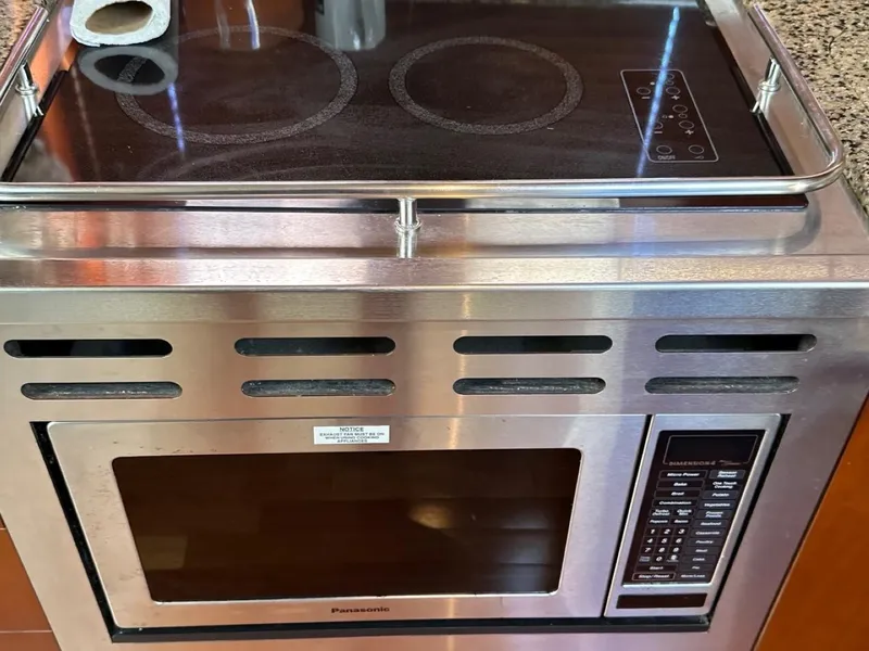 Slide: The Image of Stainless steel microwave and stovetop in 2006 Sea Ray 48 Sundancer yacht kitchen. - 10
